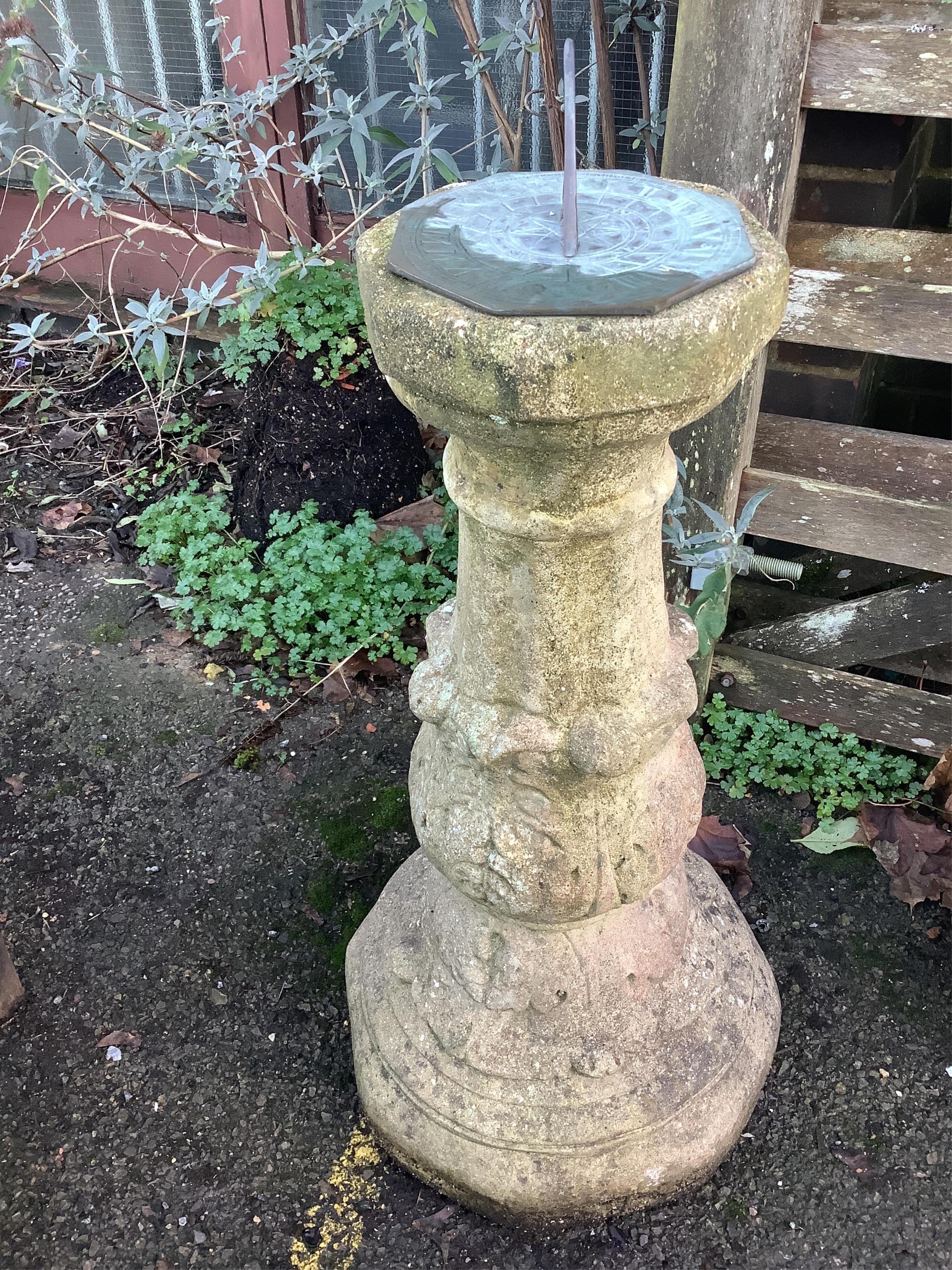 A reconstituted stone sundial, with bronze dial and gnomon, height 86cm. Condition - fair